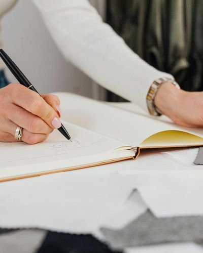 Professional design consultation with material samples and planning